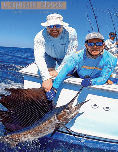 captain hook mate and angler with sailfish